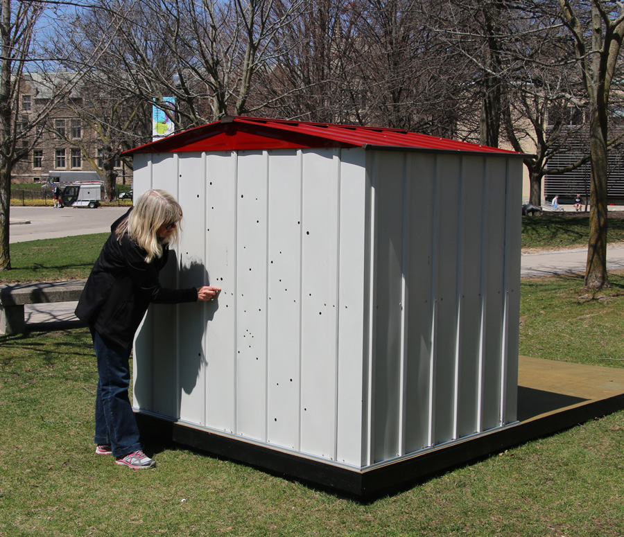 Artist Dianne Bos installing Star Shed on campus