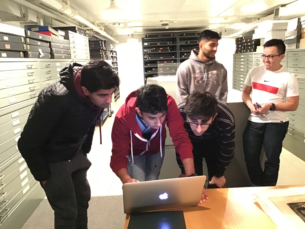 Engineering Students callibrating their device in the Paper Centre of McMaster Museum of Art