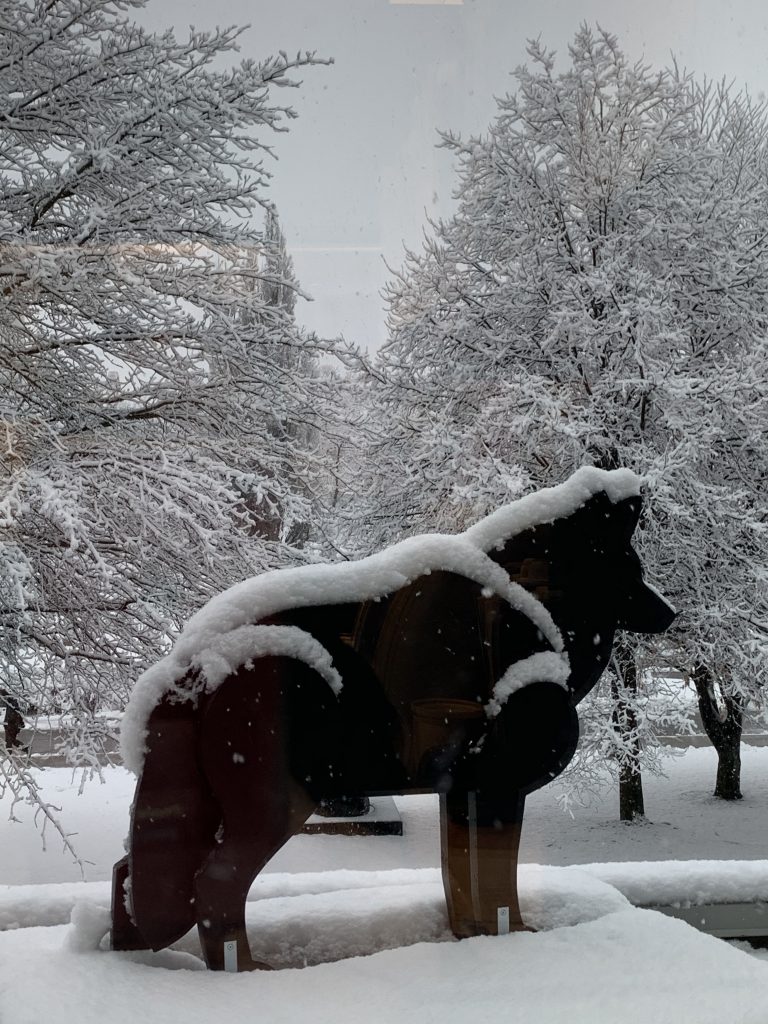 sculpture of wolf in the snow