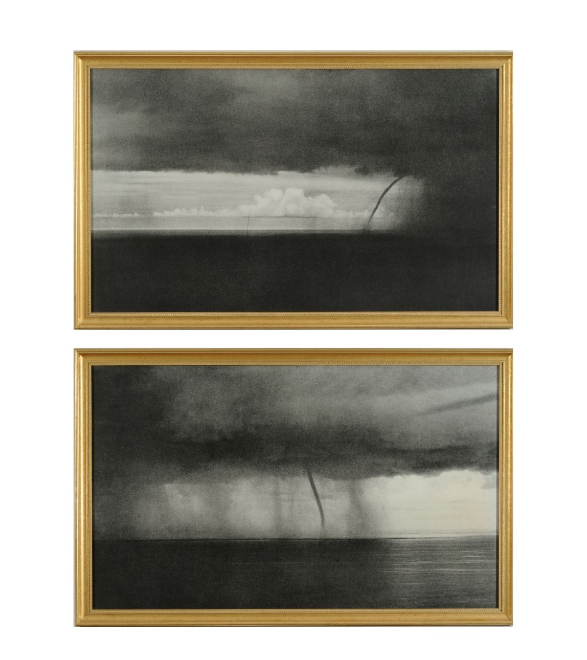 Two black and white images of hurricanes in gold frames